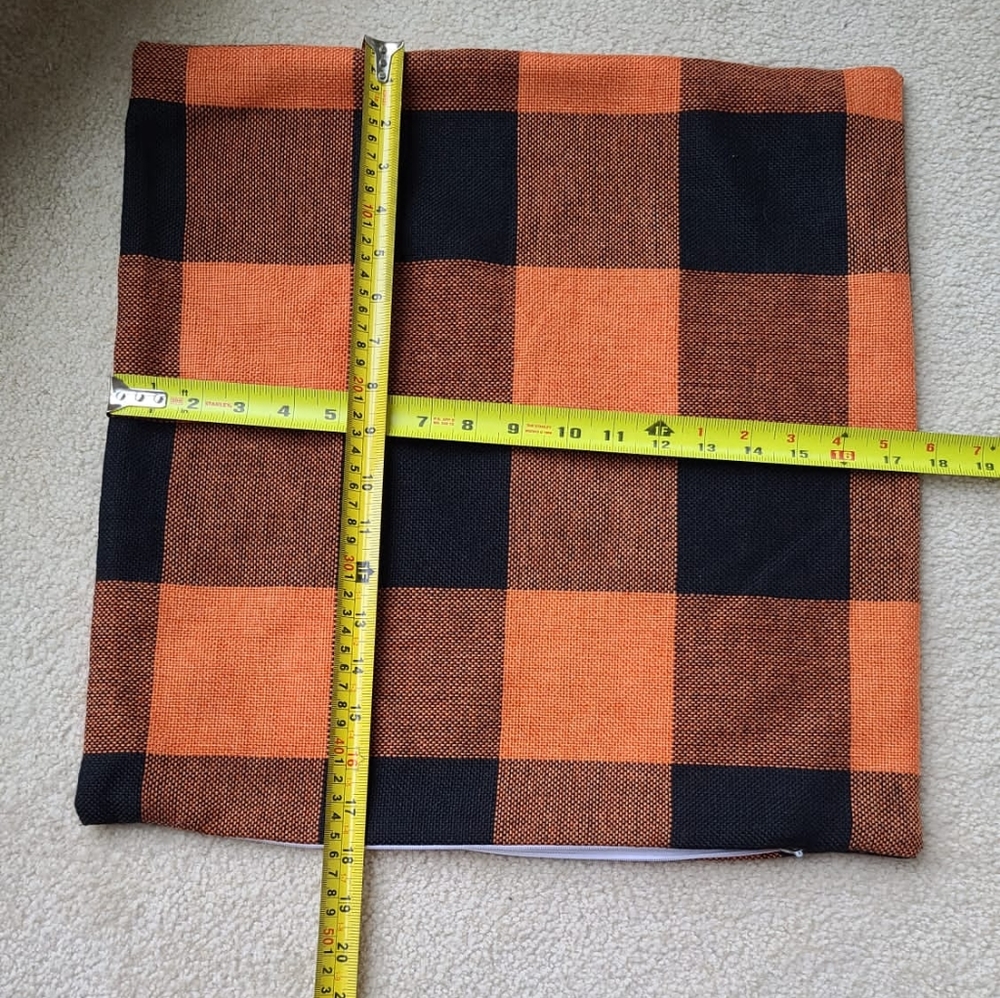Three cushion covers, 2 Gray from IKEIA , The black and the orange are no brands